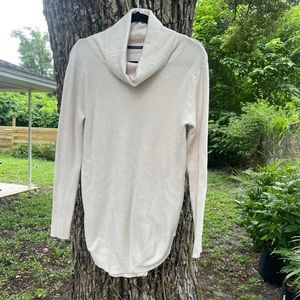 Cream, long turtle neck sweater.